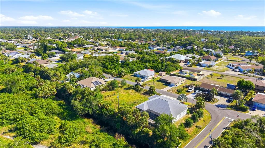 1112 Seneca Road Venice, FL 34293 - Photo 43 of 50 an aerial view of residential houses with outdoor space and trees