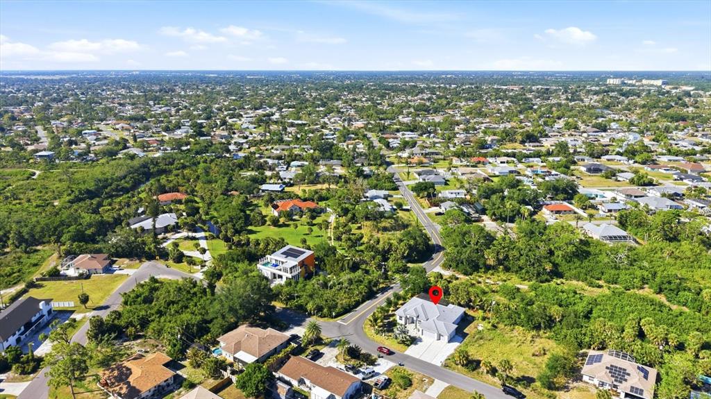 1112 Seneca Road Venice, FL 34293 - Photo 7 of 50 an aerial view of residential houses with outdoor space and trees