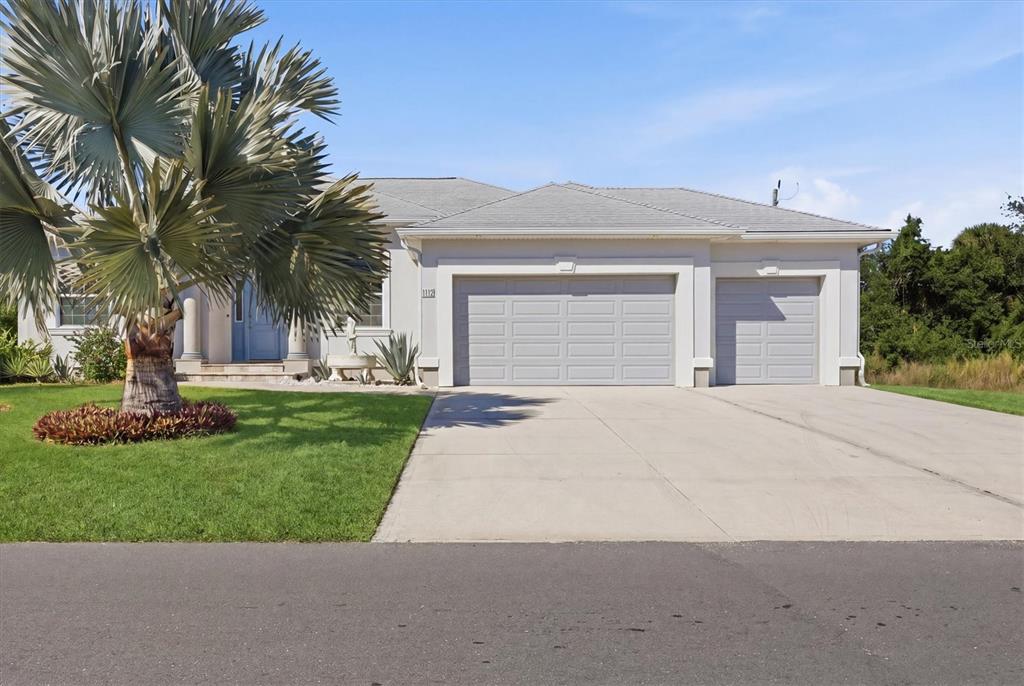1112 Seneca Road Venice, FL 34293 - Photo 10 of 50 a front view of house with yard and green space
