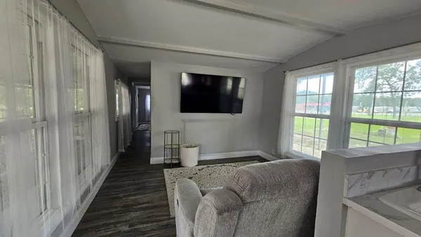 a bedroom with a bed and cabinets