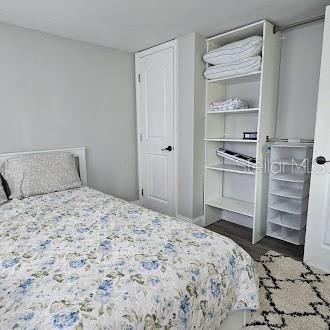 7127 West Grover Cleveland Boulevard, Unit 48 Homosassa, FL 34446 - Photo 13 of 18 a bedroom with a bed and cabinets