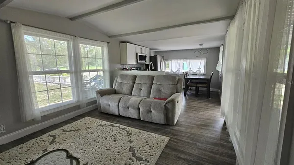 a view of livingroom with furniture and wooden floor
