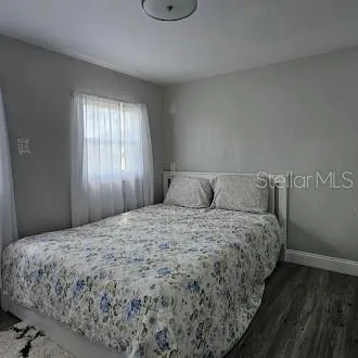 a bedroom with a bed and cabinets