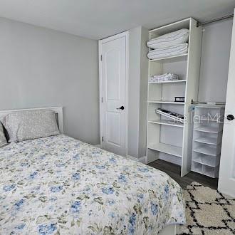 7127 West Grover Cleveland Boulevard, Unit 48 Homosassa, FL 34446 - Photo 6 of 18 a bedroom with a bed and cabinets