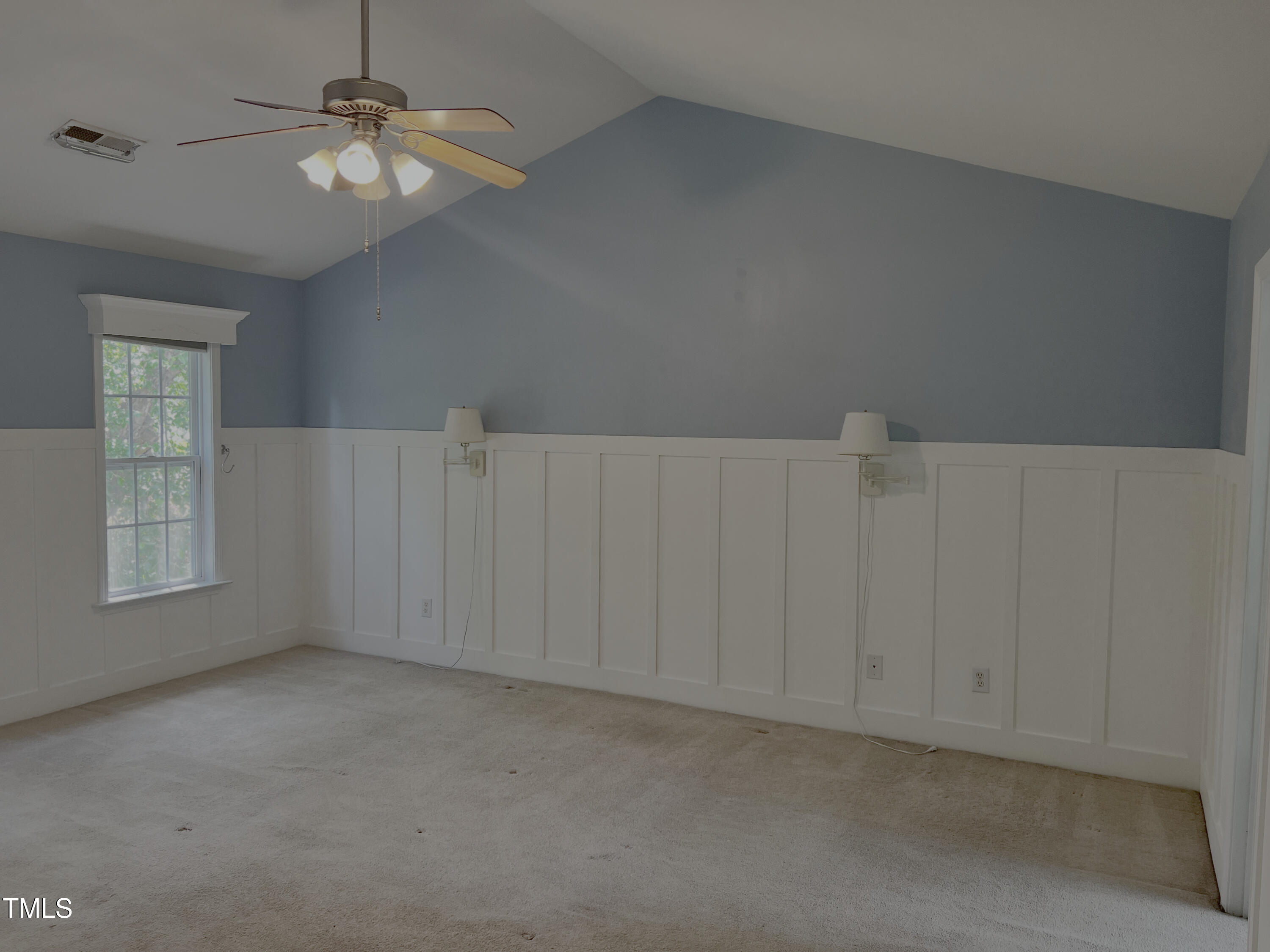 133 Rustic Lane Smithfield, NC 27577 - Photo 15 of 24 an empty room with windows and fan