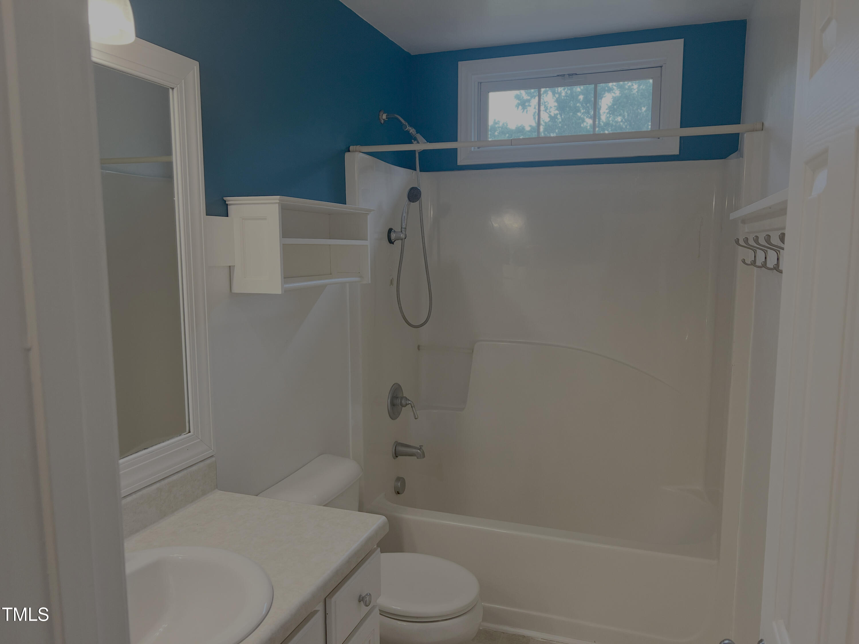 133 Rustic Lane Smithfield, NC 27577 - Photo 18 of 24 a bathroom with a toilet and shower