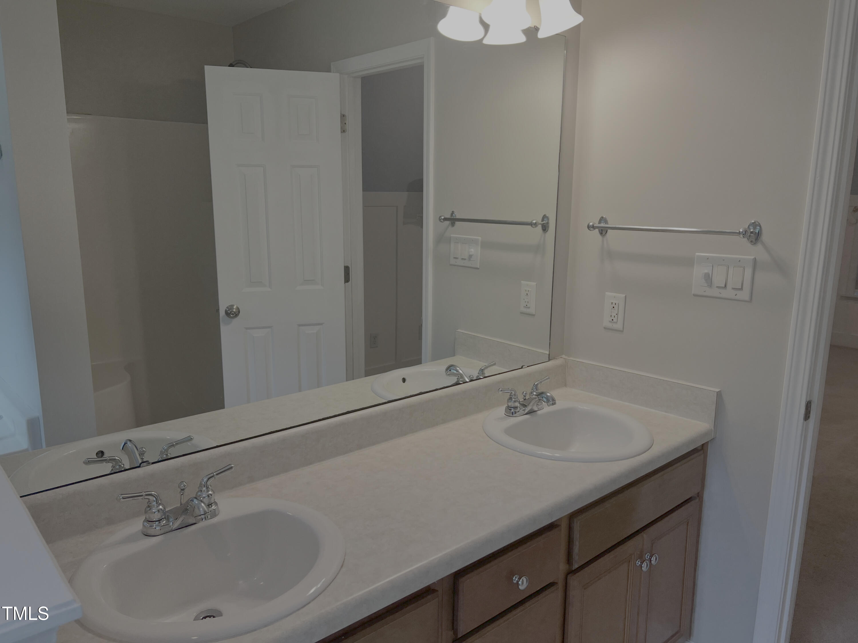 133 Rustic Lane Smithfield, NC 27577 - Photo 19 of 24 a bathroom with a sink and a mirror