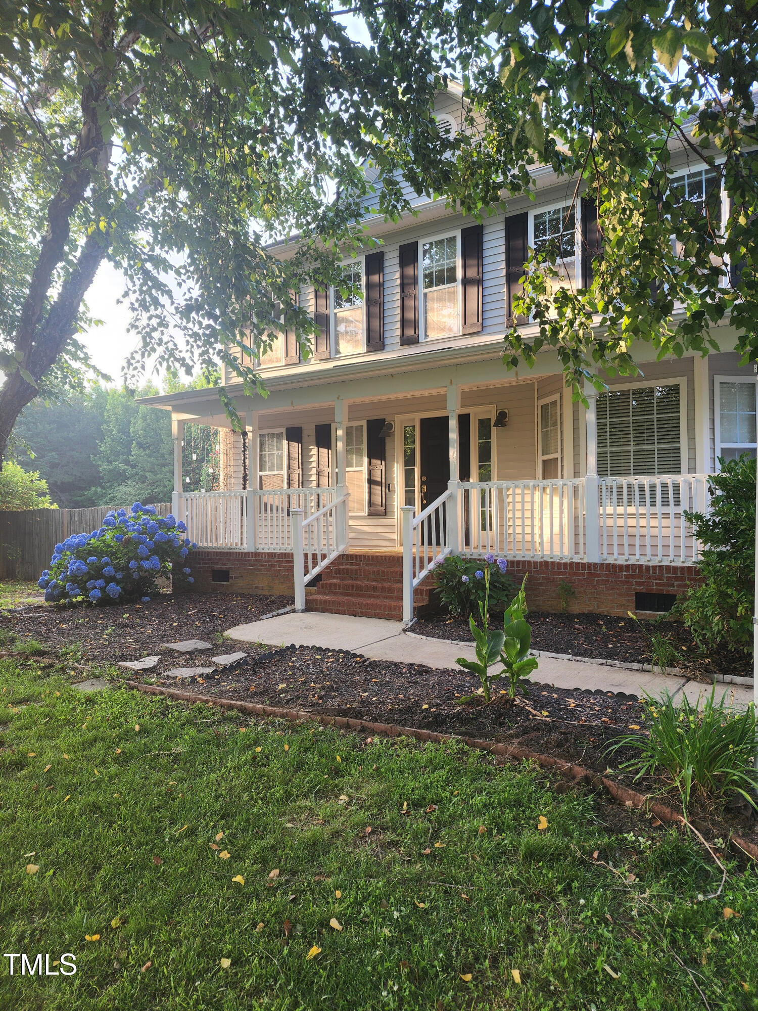 133 Rustic Lane Smithfield, NC 27577 - Photo 2 of 24 front view of a house with a yard