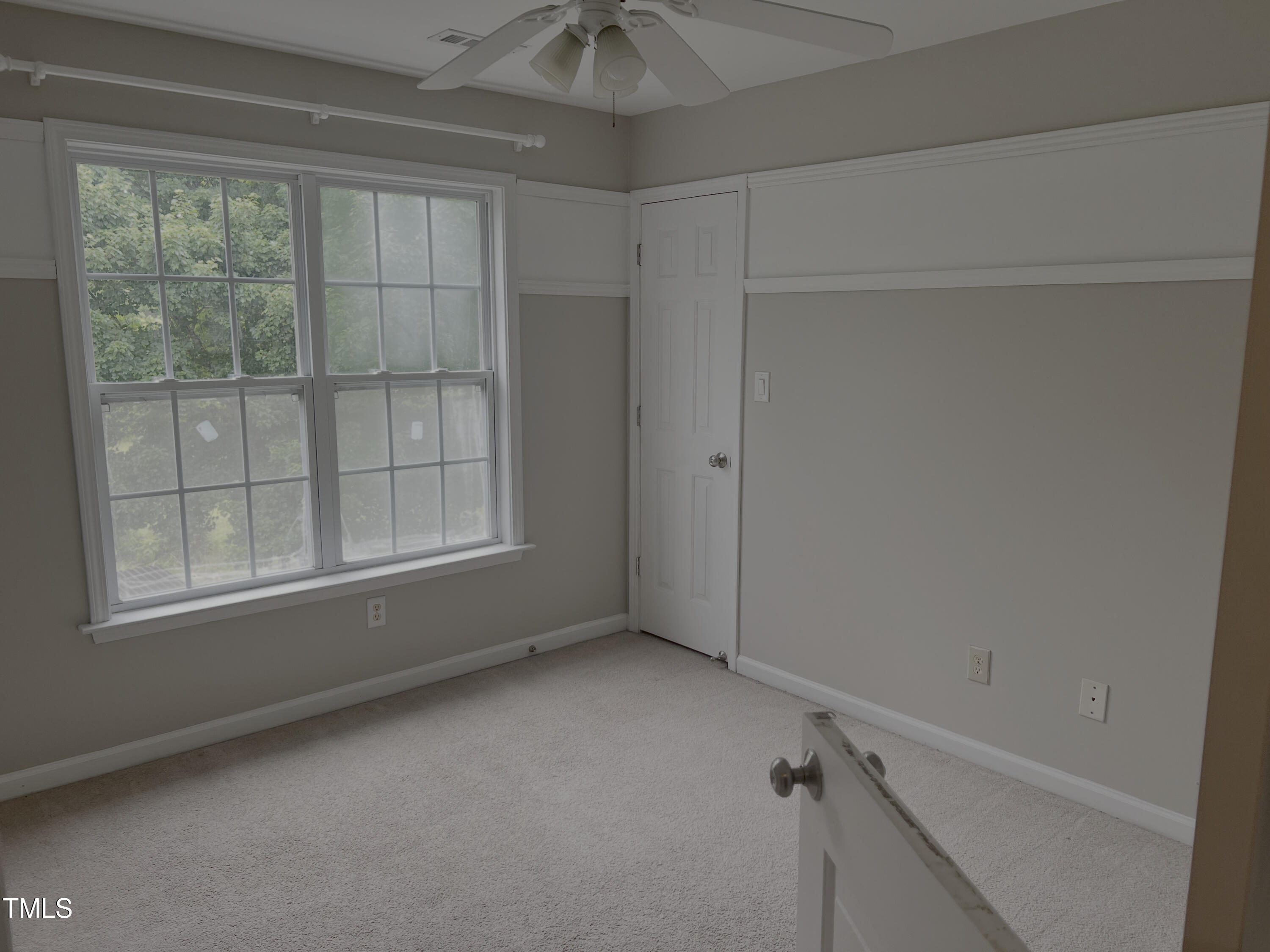133 Rustic Lane Smithfield, NC 27577 - Photo 21 of 24 a view of an empty room with a window