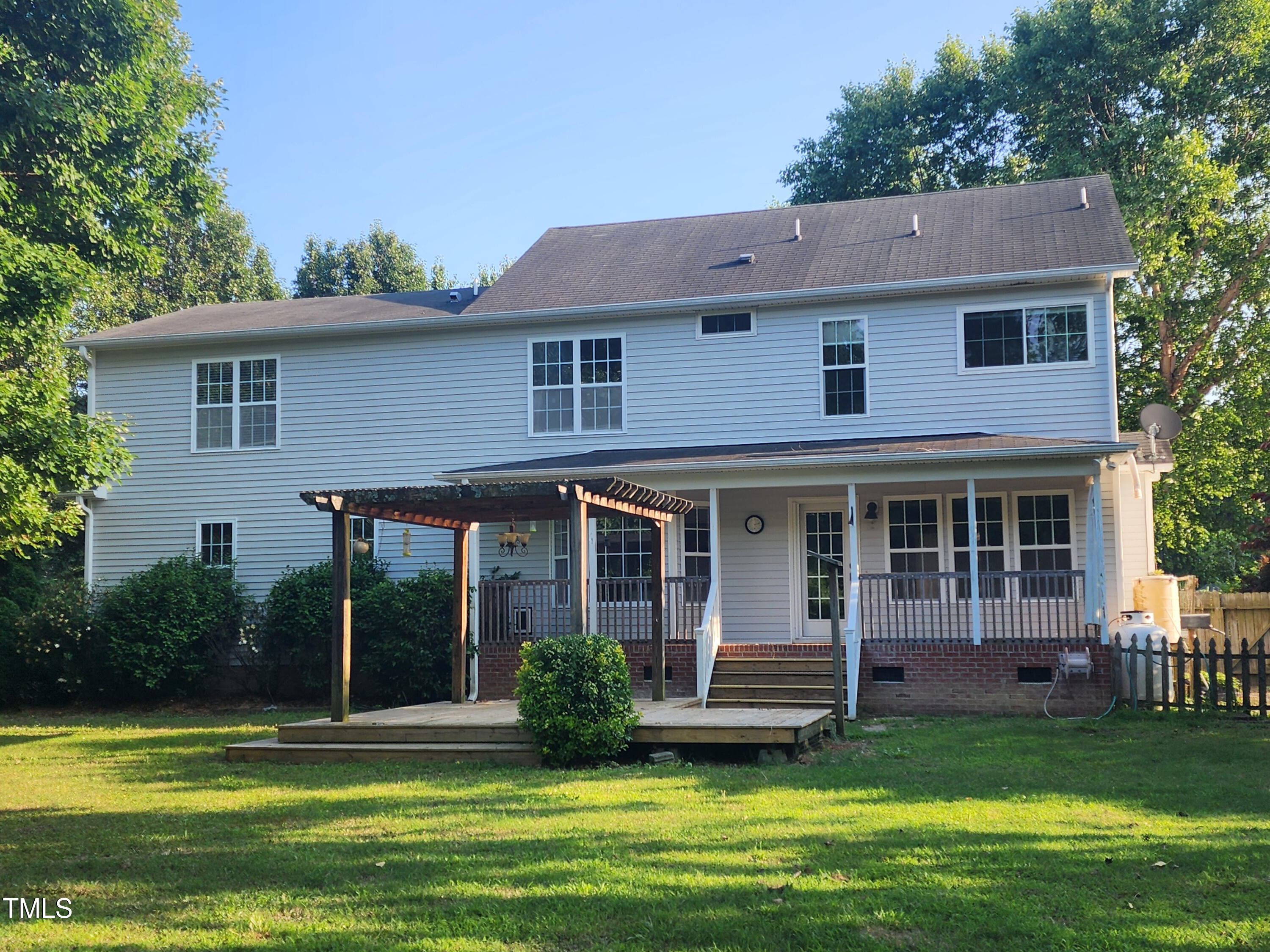 133 Rustic Lane Smithfield, NC 27577 - Photo 3 of 24 a view of a house with a swimming pool