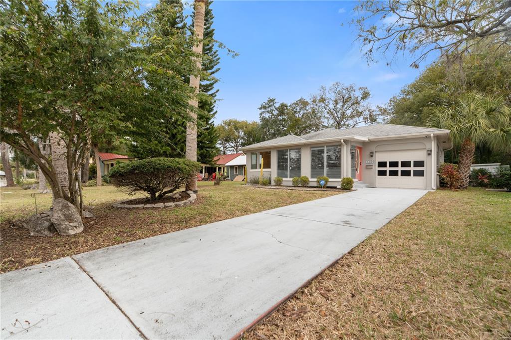 6832 Grand Boulevard New Port Richey, FL 34652 - Photo 1 of 1 a view of a house with a yard
