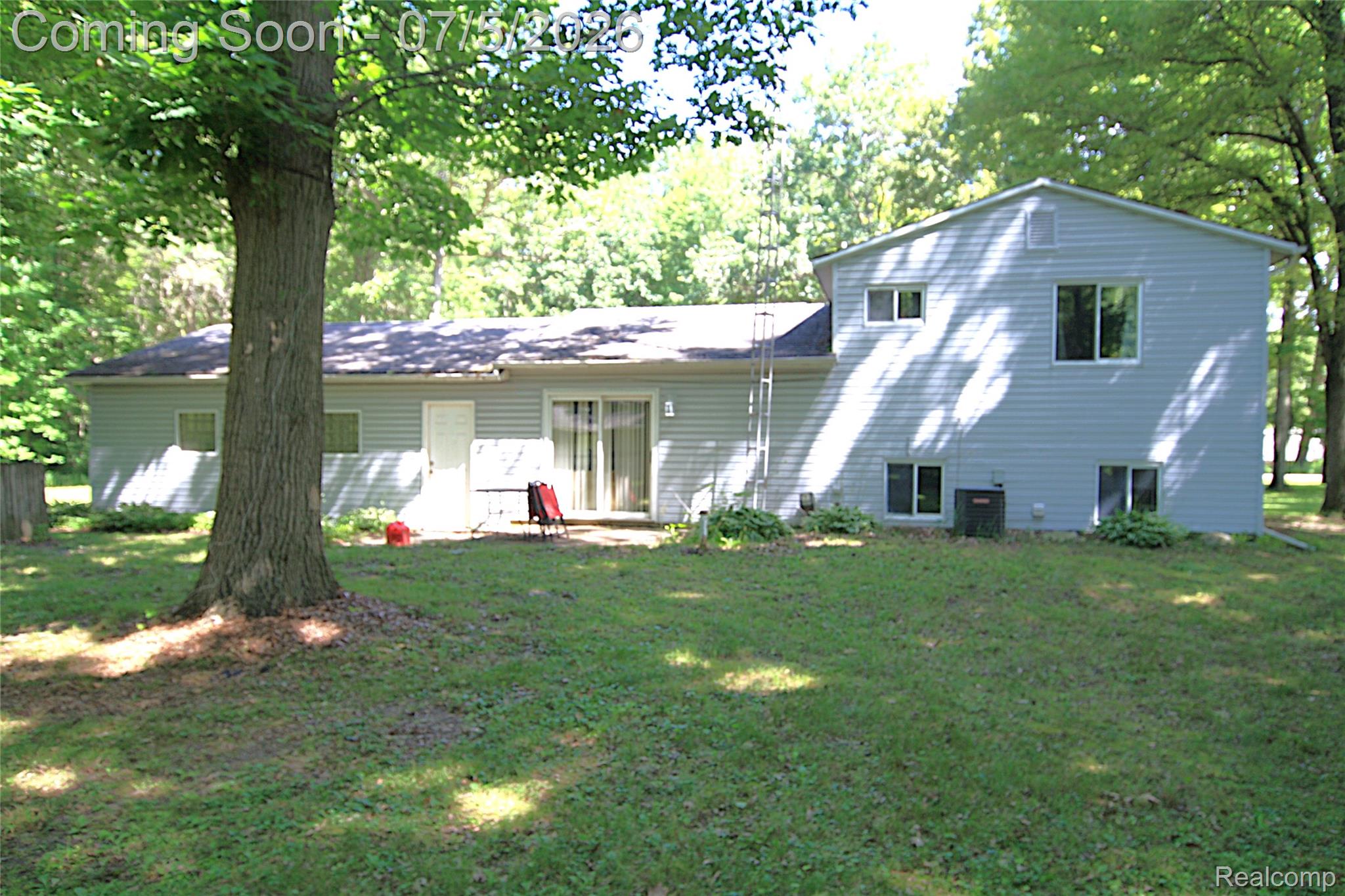 12403 Willard Road Montrose, MI 48457 - Photo 2 of 30 Rear exterior featuring light gray siding