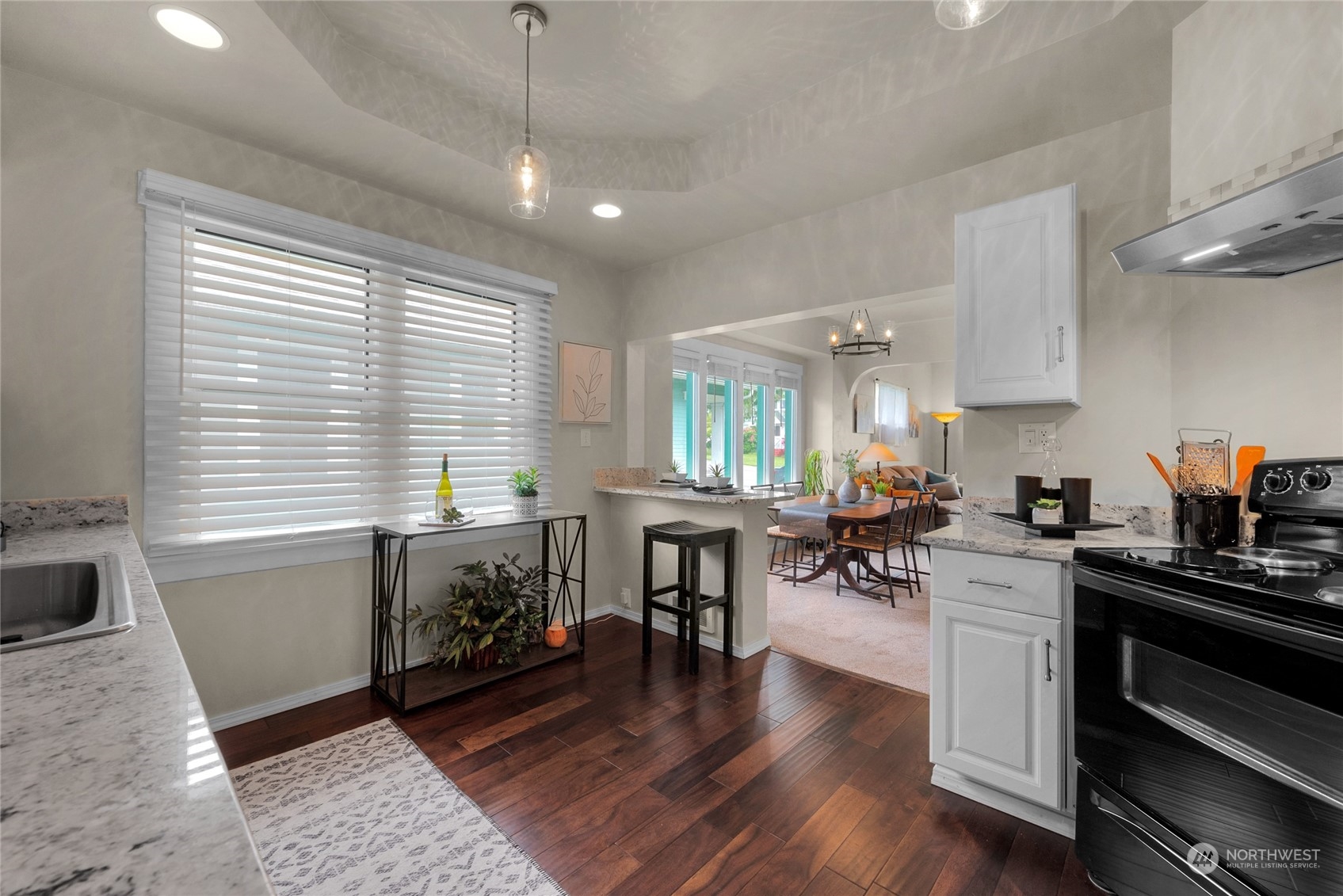 2708 18th Street Everett, WA 98201 - Photo 13 of 29 a kitchen with a table chairs stove and cabinets