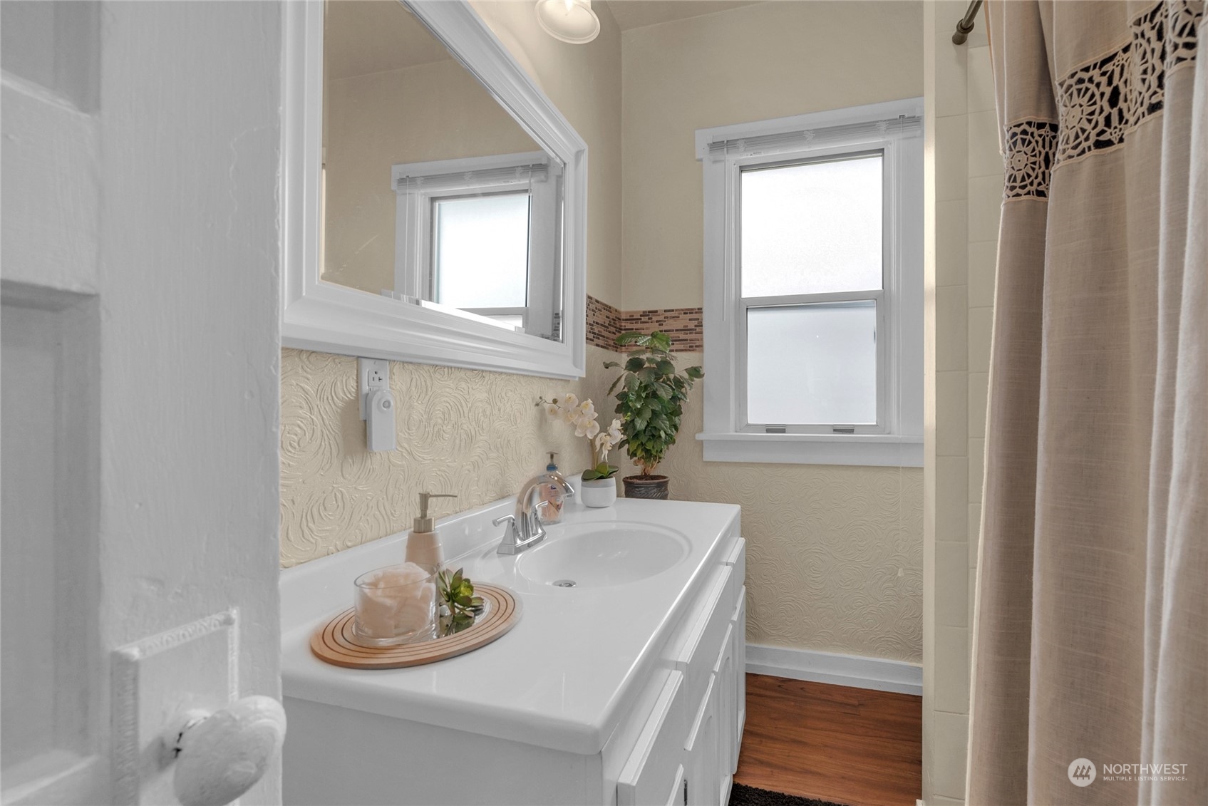 2708 18th Street Everett, WA 98201 - Photo 16 of 29 a kitchen with a sink and a window with wooden floor