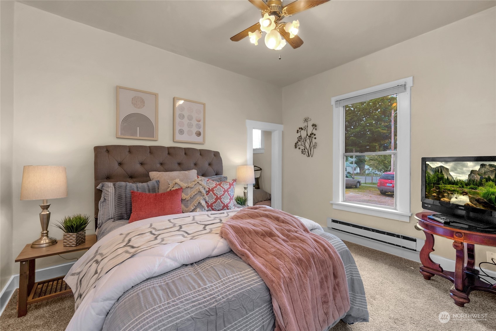 2708 18th Street Everett, WA 98201 - Photo 17 of 29 a bedroom with a bed and a tv on the dresser