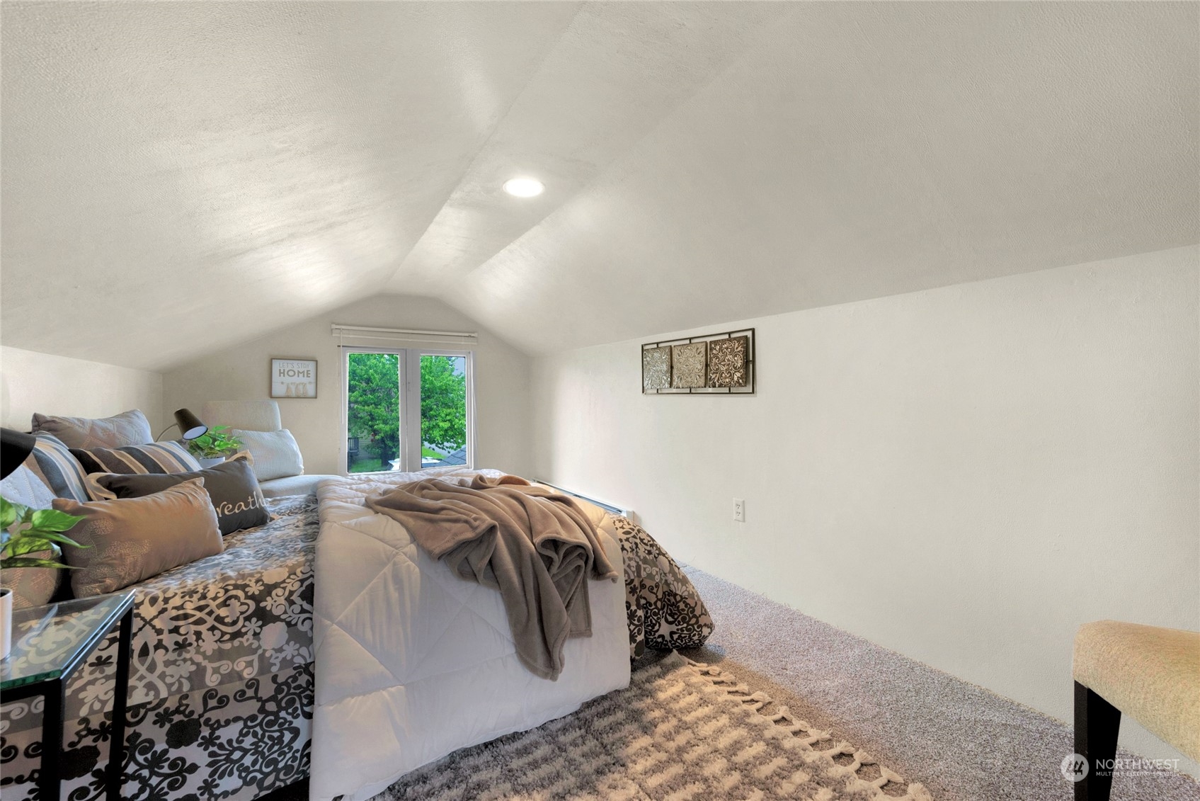 2708 18th Street Everett, WA 98201 - Photo 19 of 29 a bed sitting in a bedroom next to a window with lamp