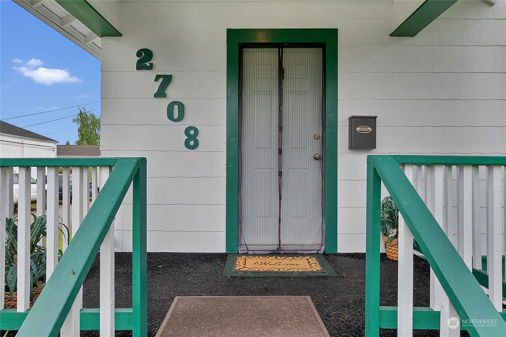 2708 18th Street Everett, WA 98201 - Photo 4 of 29 a front view of a house with wooden stairs