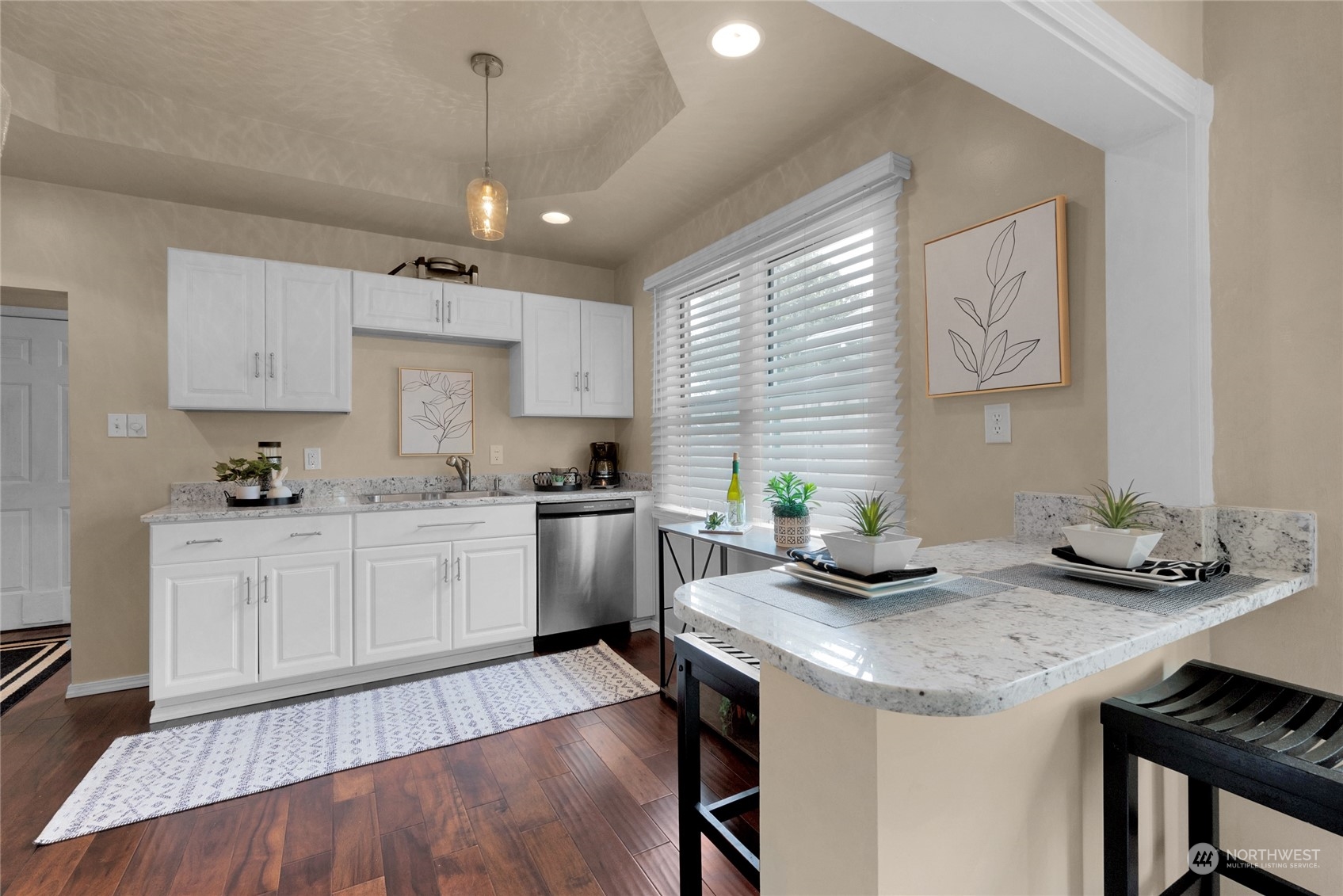 2708 18th Street Everett, WA 98201 - Photo 10 of 29 a kitchen with granite countertop kitchen island stainless steel appliances a table and chairs in it