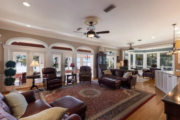 a kitchen with granite countertop a refrigerator stove and microwave