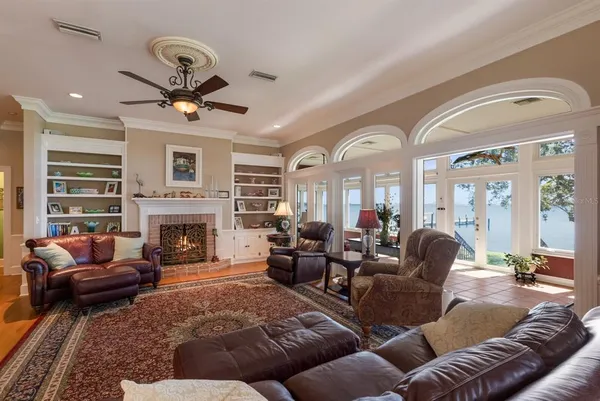 a kitchen with stainless steel appliances granite countertop a sink a stove and cabinets