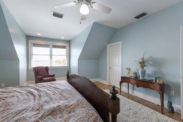 a room with chairs and piano table