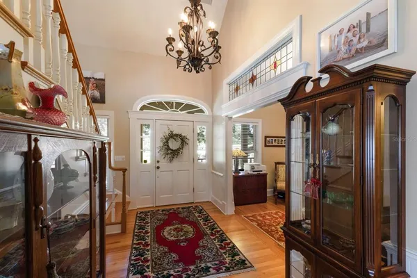 a living room with furniture ceiling fan and a fireplace