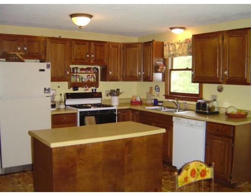 920 Piper Road Ashby, MA 01431 - Photo 8 of 17 a kitchen with granite countertop a sink a stove top oven a counter space and cabinets