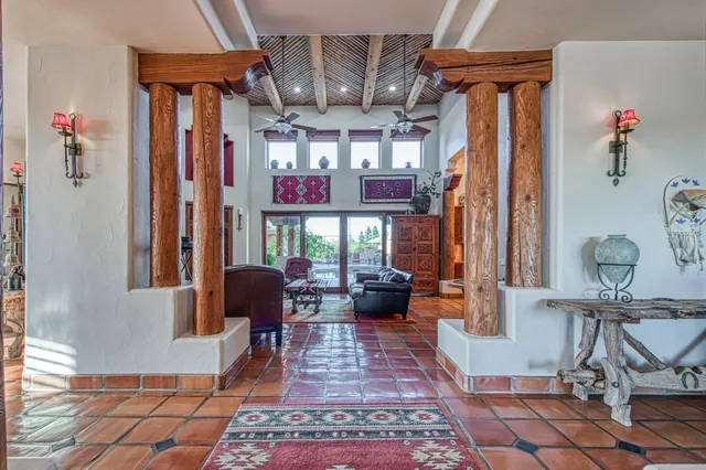 a view of a dining room with furniture wooden floor and a chandelier