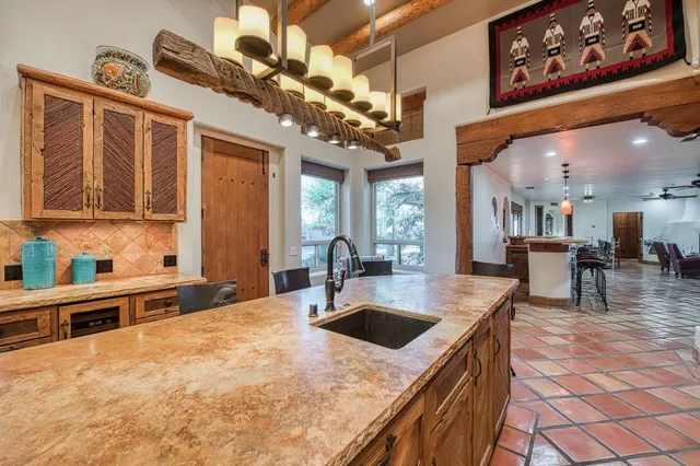 a view of a porch with furniture and floor to ceiling window