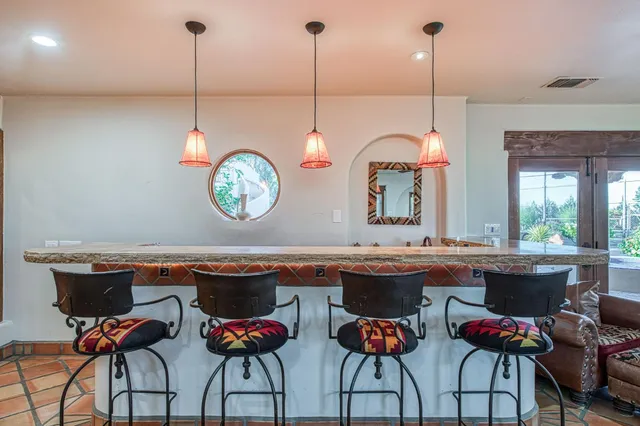 a view of swimming pool with outdoor seating