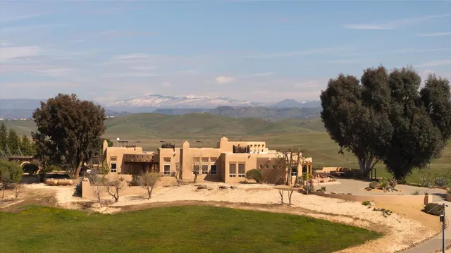 a swimming pool view with a outdoor seating space