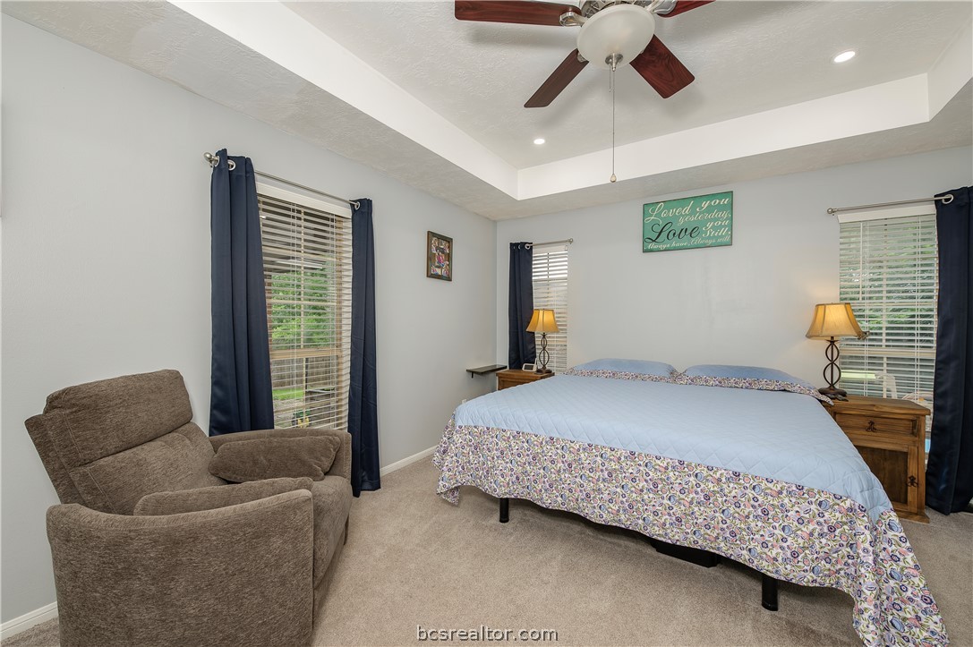 2009 Cobblestone Lane Bryan, TX 77807 - Photo 12 of 23 a bedroom with a bed couch and window