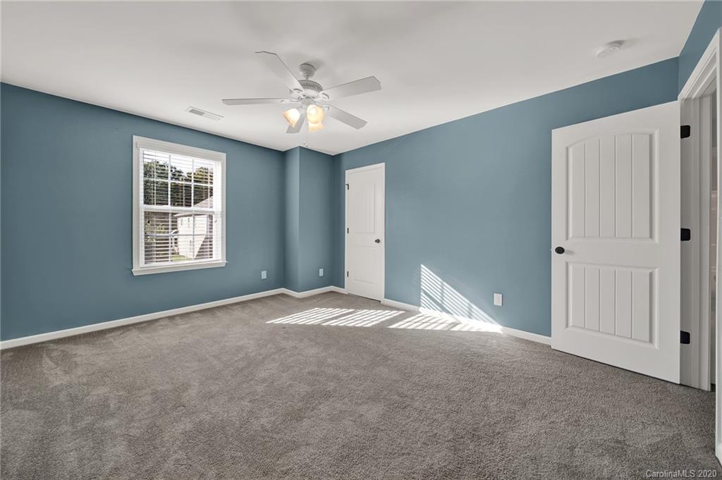 144 Annatto Way Tega Cay, SC 29708 - Photo 22 of 48 a view of an empty room with a window