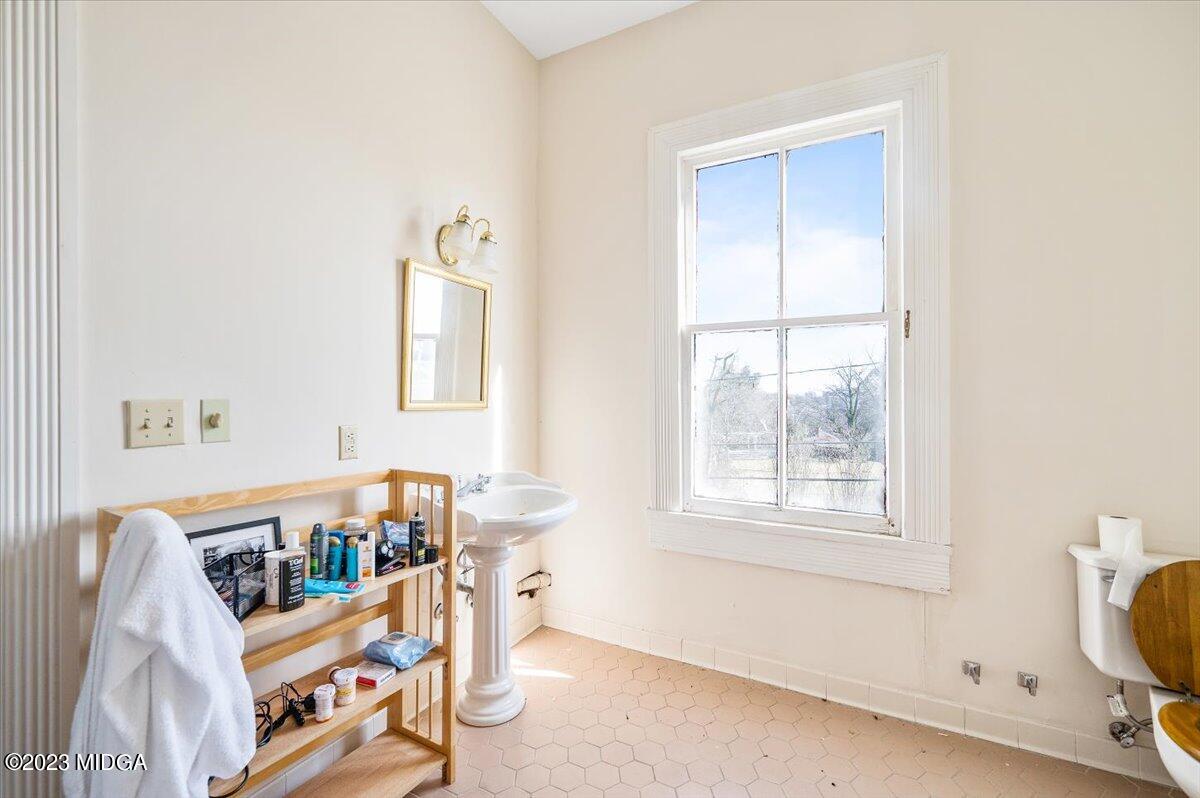 461 Pursley Street Macon, GA 31201 - Photo 20 of 25 a bedroom with furniture and a window