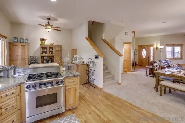 a kitchen with stove and cabinets