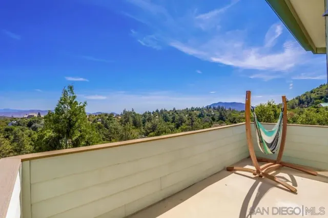 a view of a balcony with chairs