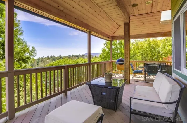 a view of a chair and table in the balcony