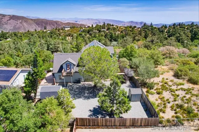 an aerial view of a house with a garden