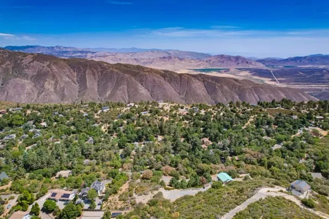 an aerial view of residential house with an outdoor space