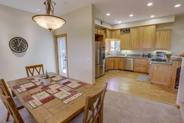 a kitchen with a table and chairs in it