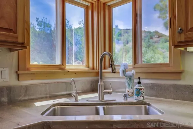 a kitchen with a sink and a window