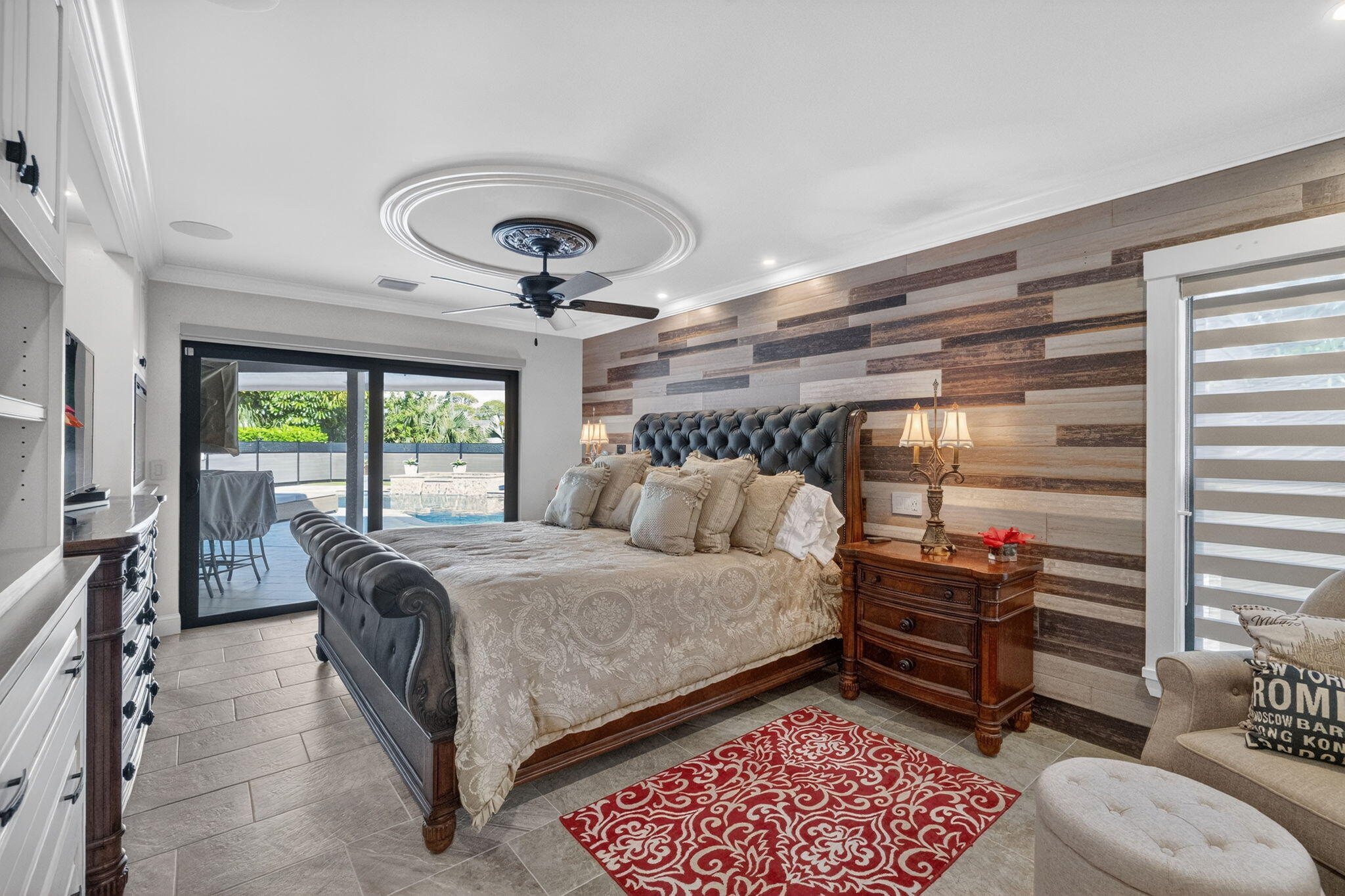 5212 Foxpointe Circle Delray Beach, FL 33445 - Photo 22 of 89 a bed room with a bed and a chandelier