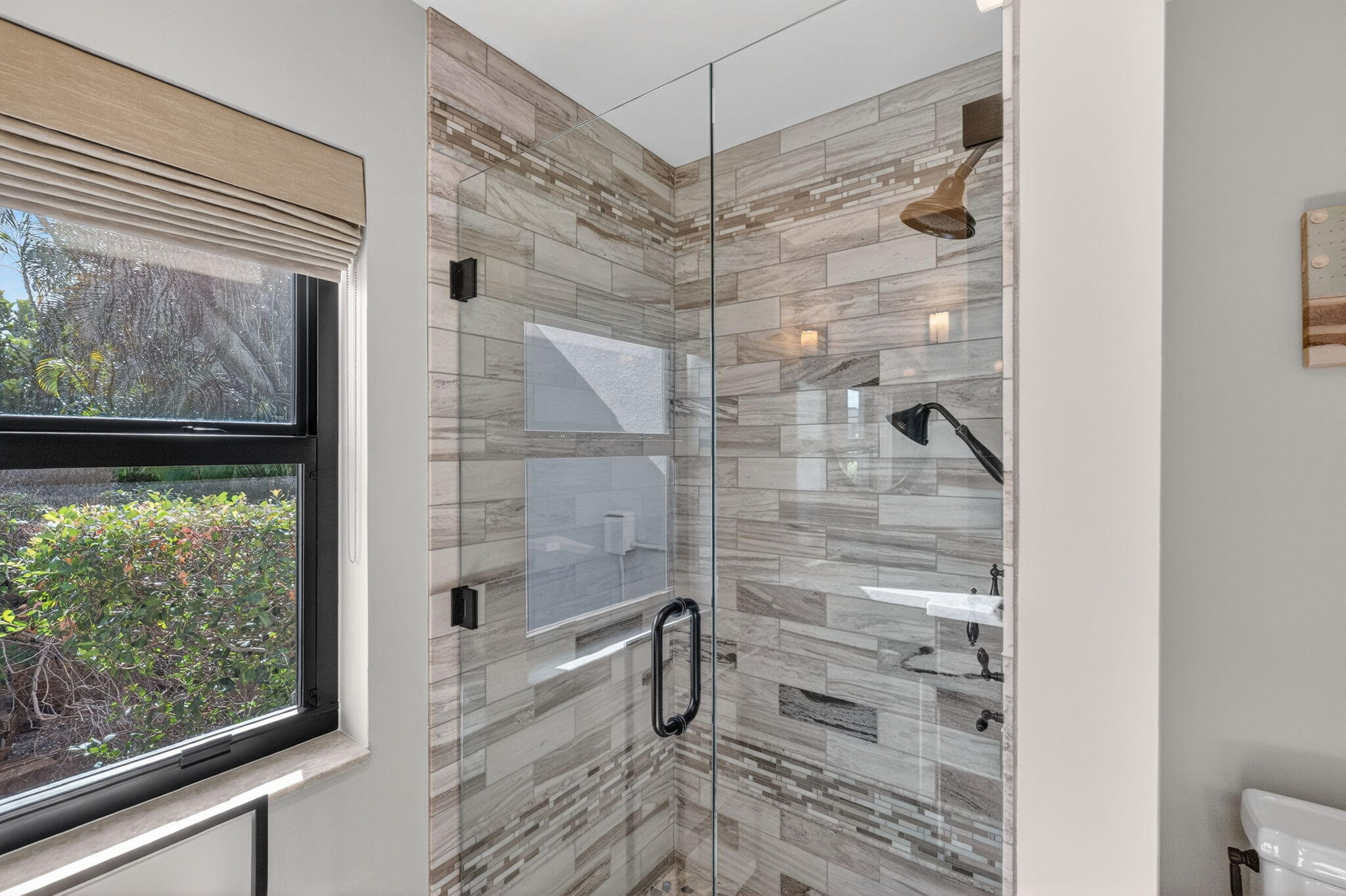 5212 Foxpointe Circle Delray Beach, FL 33445 - Photo 37 of 89 a bathroom with a glass shower door