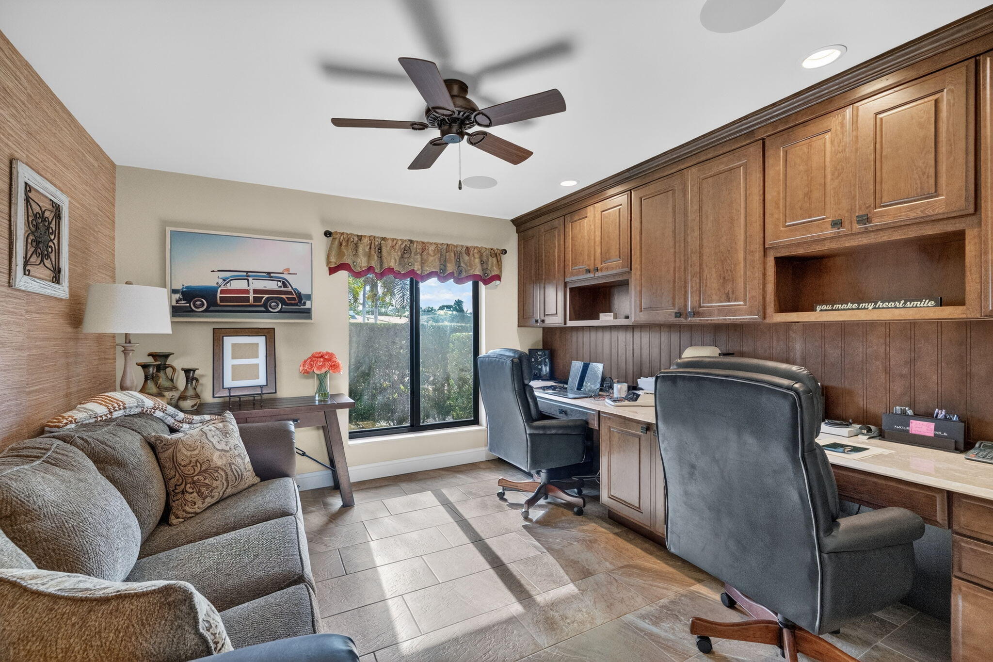 5212 Foxpointe Circle Delray Beach, FL 33445 - Photo 38 of 89 a living room with furniture a flat screen tv and a window