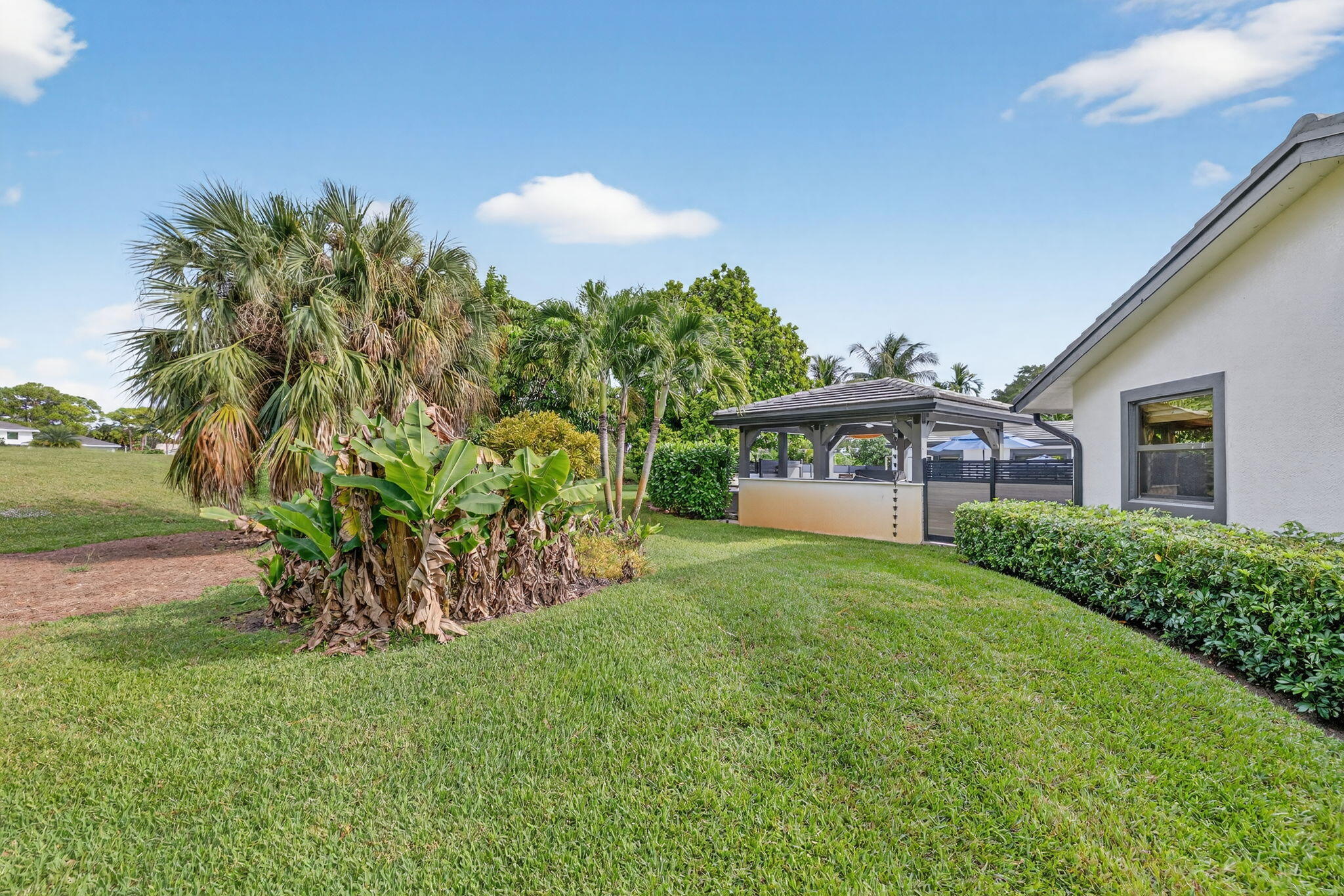 5212 Foxpointe Circle Delray Beach, FL 33445 - Photo 60 of 89 a front view of house with yard and outdoor seating