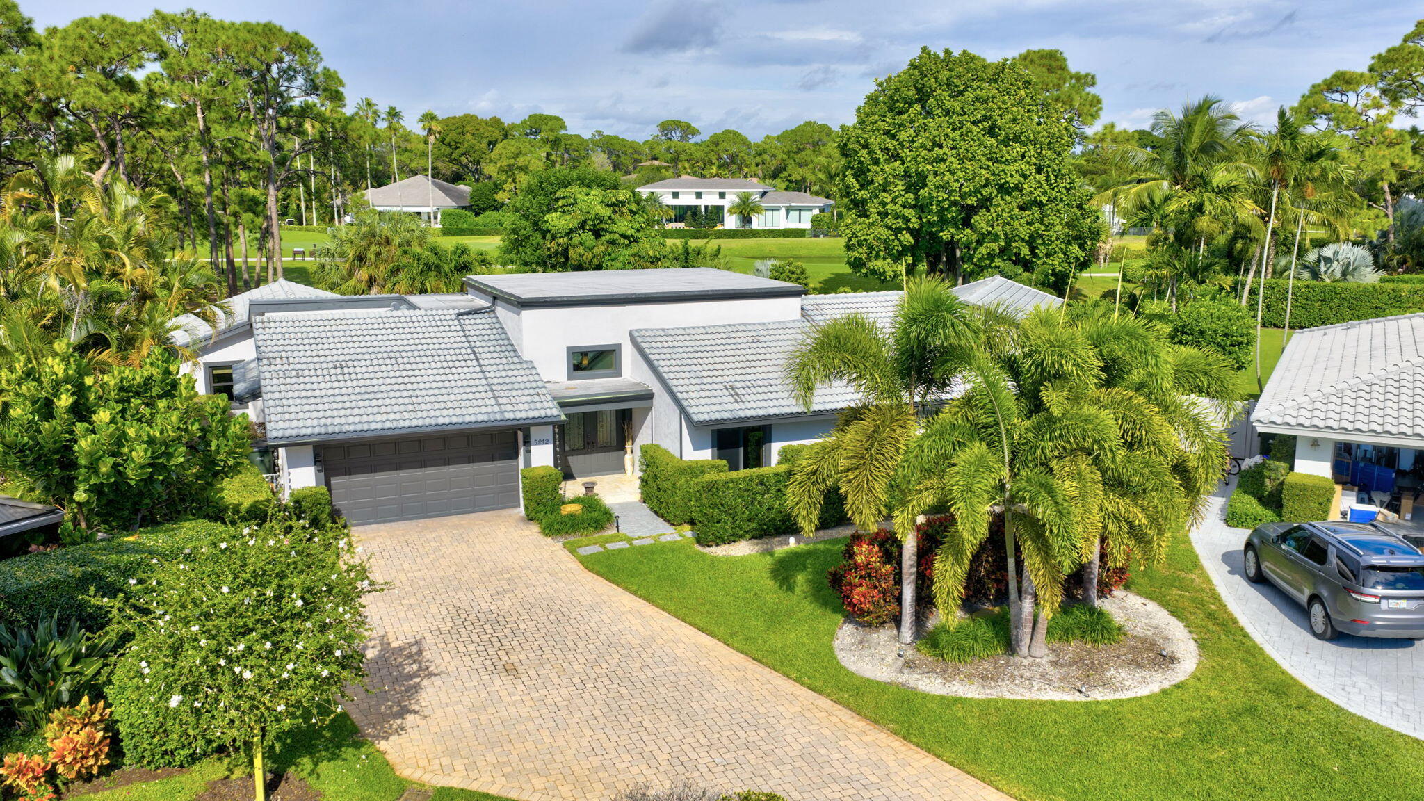5212 Foxpointe Circle Delray Beach, FL 33445 - Photo 61 of 89 an aerial view of a house with a garden and lake view