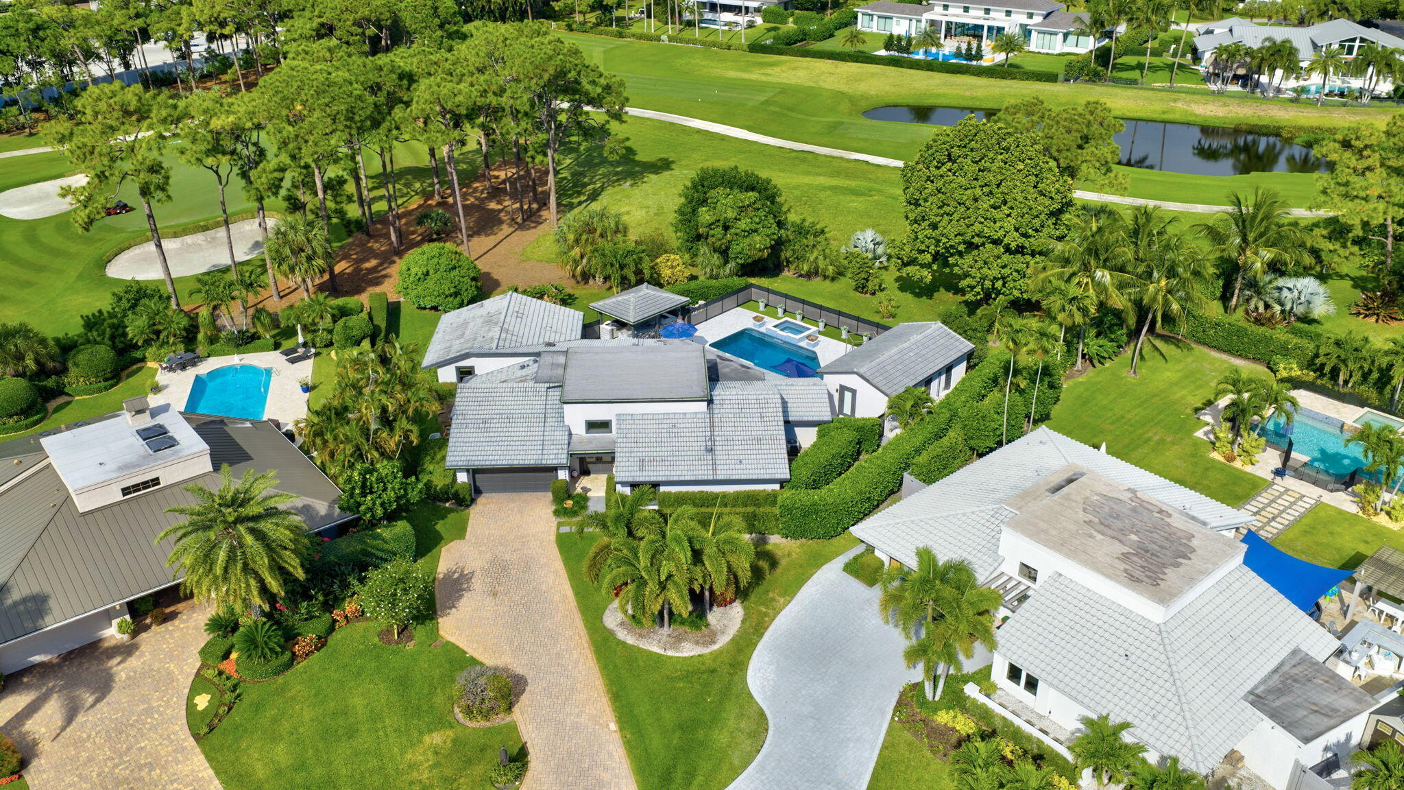 5212 Foxpointe Circle Delray Beach, FL 33445 - Photo 63 of 89 an aerial view of a house with a yard basket ball court and outdoor seating