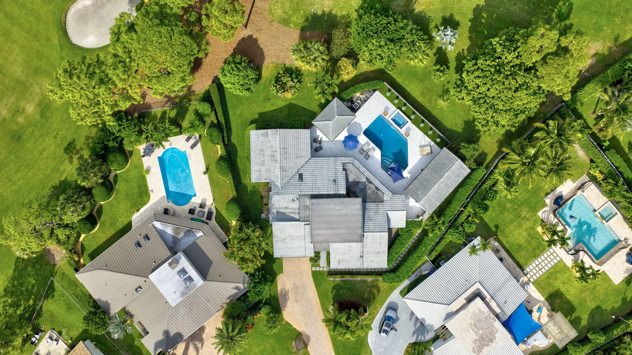 5212 Foxpointe Circle Delray Beach, FL 33445 - Photo 64 of 89 an aerial view of a house with outdoor space and swimming pool