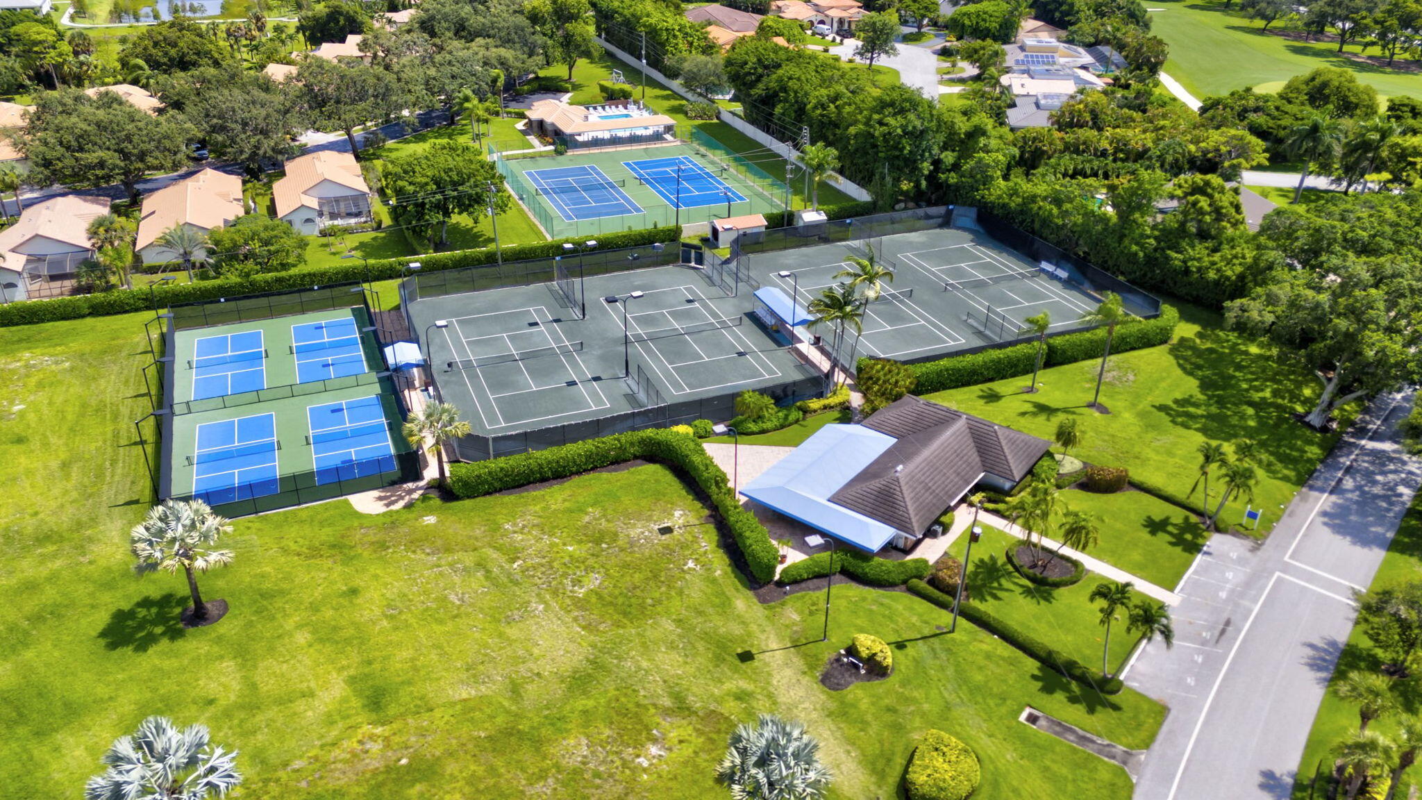 5212 Foxpointe Circle Delray Beach, FL 33445 - Photo 78 of 89 an aerial view of a house with a garden and swimming pool