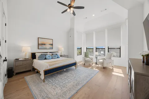 a en suite bathroom with a double vanity sink mirror and bathtub